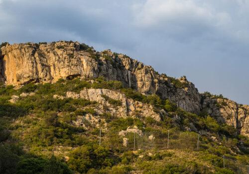 hill-covered-in-greenery-and-rocks-in-the-arrabida